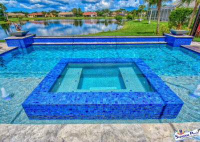 a blue tiled spa and pool in Fort Myers