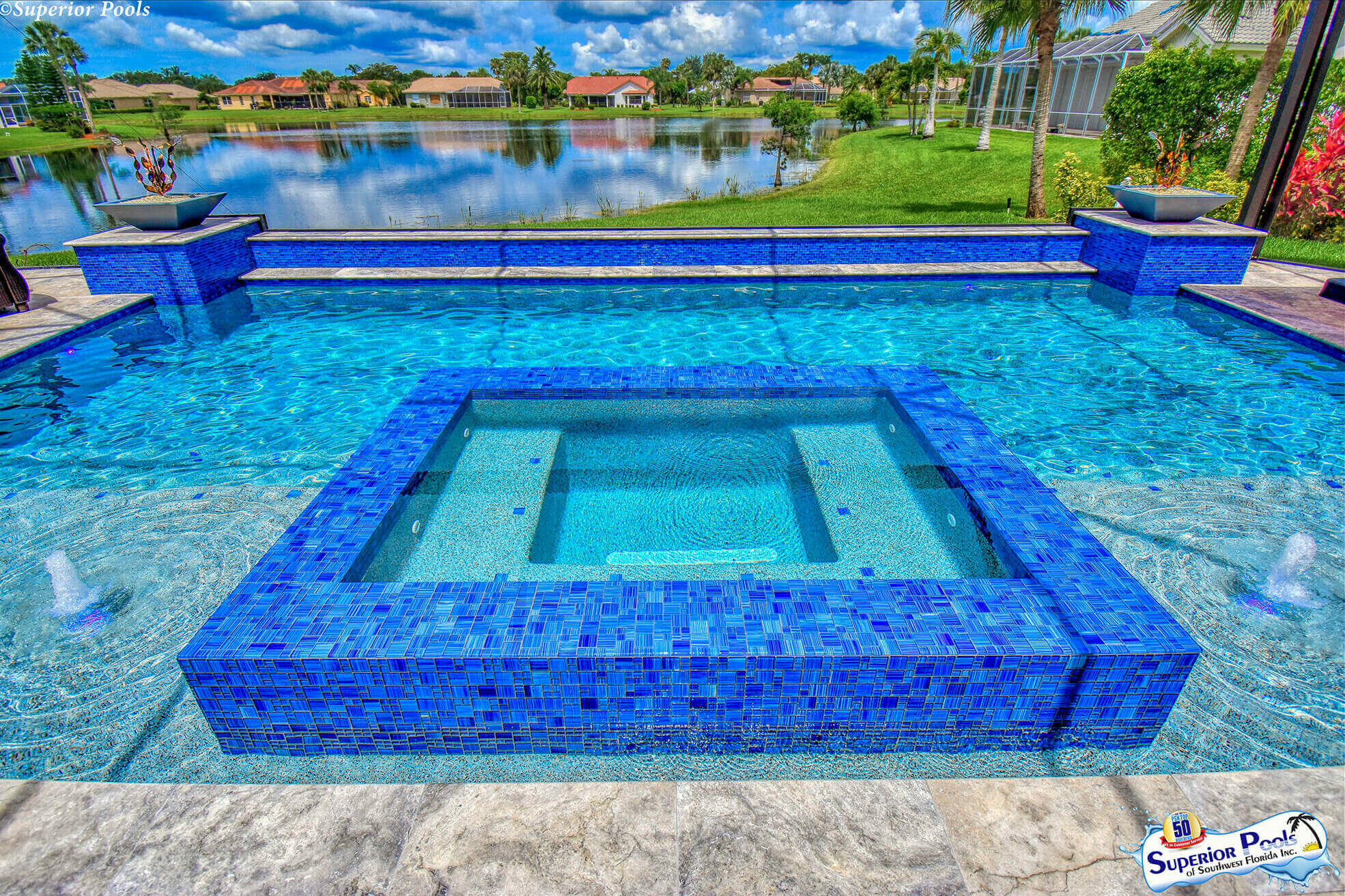 a blue tiled spa and pool in Ft Myers